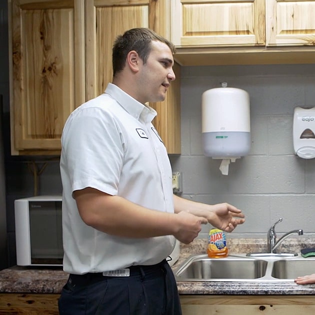 A Reimer plumber explains the drain cleaning process to a local homeowner in Buffalo, NY.