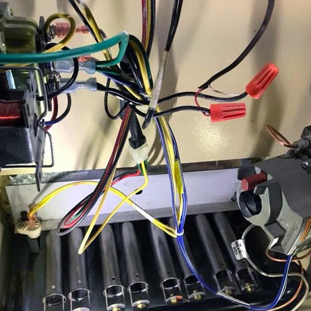 Our HVAC technician sets the wiring of this new furnace, installed in a local home here in Tonawanda, NY.
