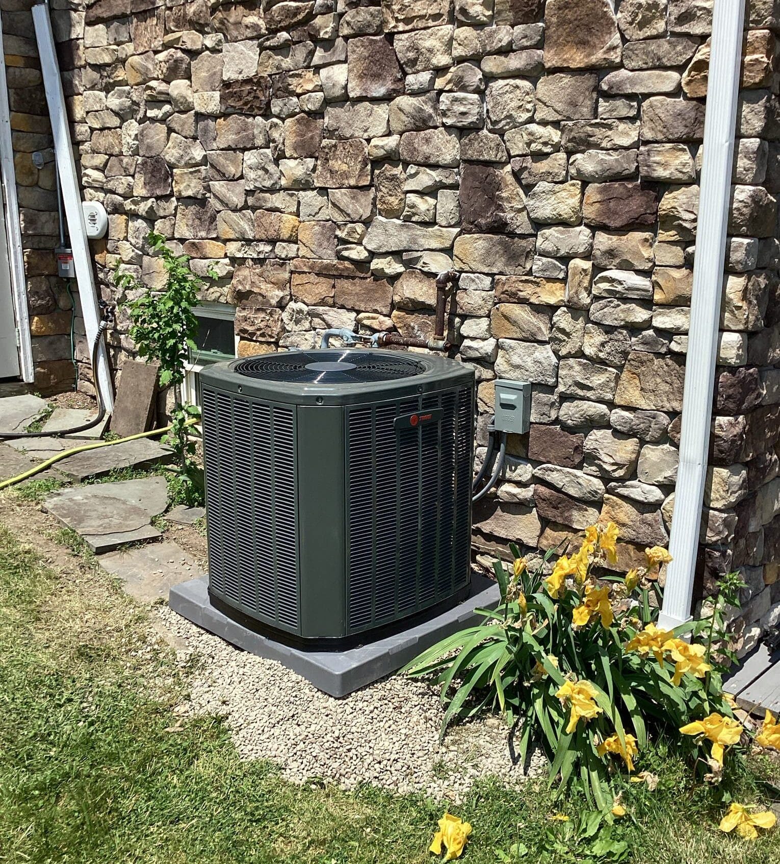 This Reimer AC expert works on this local air conditioner as part of a springtime tune-up.