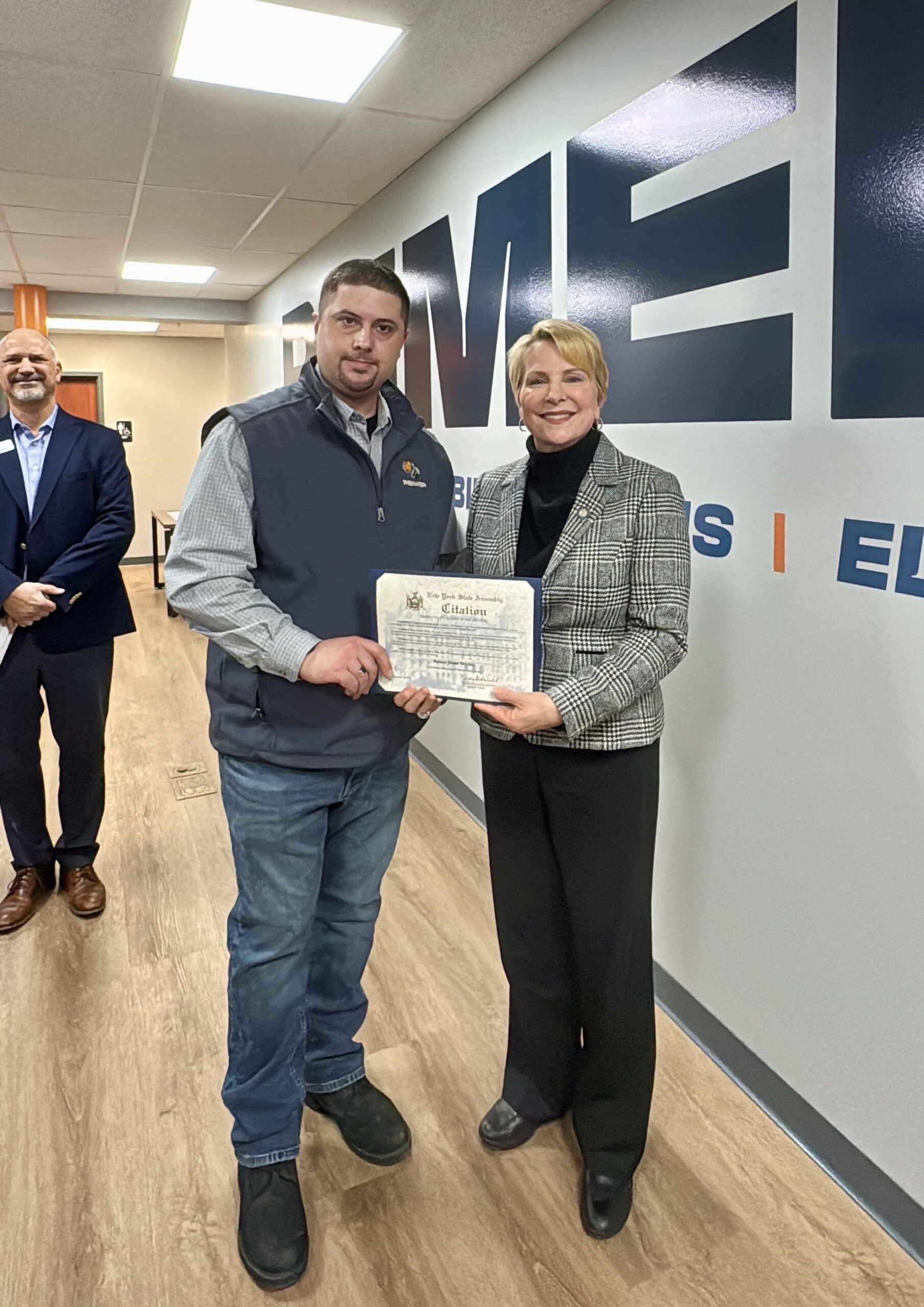 Community leaders and Reimer team during office opening event